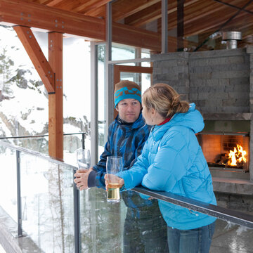 Man and Woman Standing on Chalet Balcony, Whistler, British Columbia, Canada
