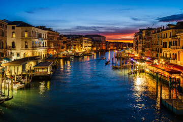 Evening cityscape in Venice, Italy; Sunset over Grand Canal from Rialto Bridge