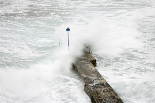 Waves Crashing on Pier, Canyamel, Majorca, Spain