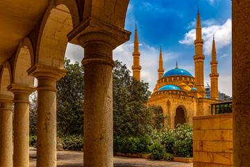 Lebanon. Beirut, capital of Lebanon. Cloisters of Saint George Greek Orthodox Cathedral. There is Mohammad Al-Amim Mosque in the background - obrazy, fototapety, plakaty