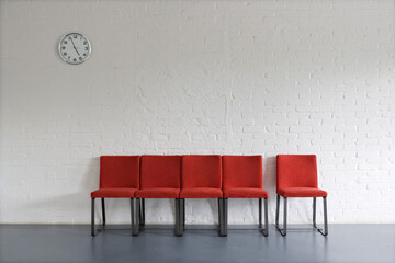 Red Chairs and Wall Clock