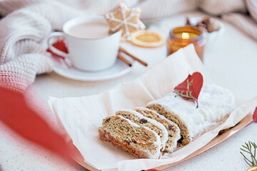  Aesthetic traditional Christmas breakfast. German stollen cake, coffee, cookies. Happy holidays.
