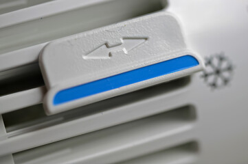 Closeup of isolated manual heater thermostat with snowflake icon symbol for frost protection...