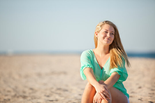 Portrait of Young Woman Sitting on Beach, Palm Beach Gardens, Palm Beach County, Florida, USA