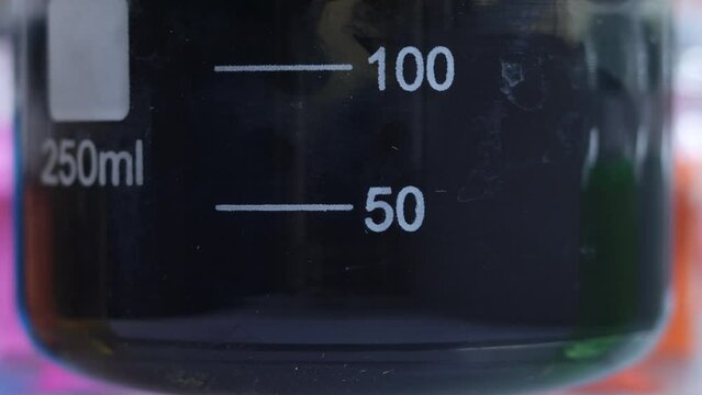 The process of obtaining a more amount of water-insoluble inorganic substance - black iron sulfide in a beaker.