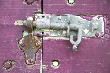 Close-Up of Sliding Bolt Lock on Purple Gate