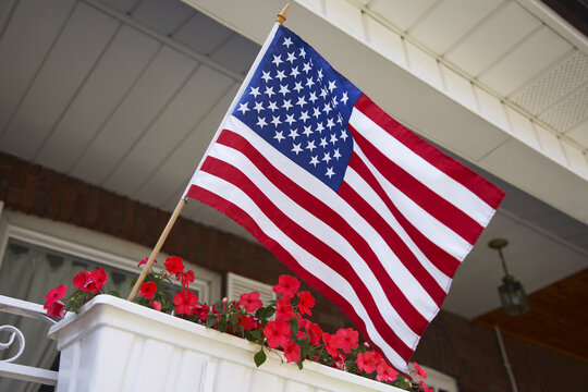 American Flag Flying From Porch