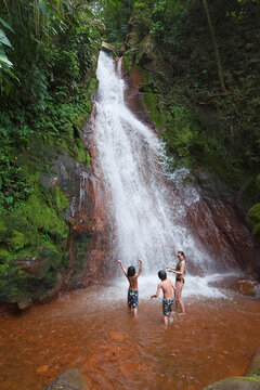 Mother and Boys Playing in Waterfall, Miravalles, Cordillera de Guanacaste, Guanacaste, Costa Rica
