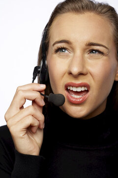 Angry Businesswoman Talking on Headset