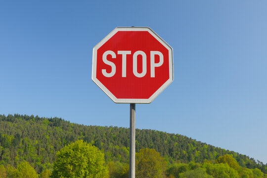 Stop Sign in front of Forest, Pfalzerwald, Rhineland-Palatinate, Germany
