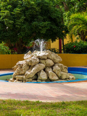 Relaxing resort water fountain made from large boulders