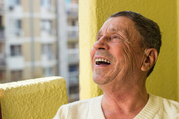 Portrait of retired happiness senior man sitting at home