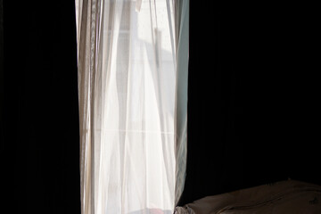 white curtains in the dark