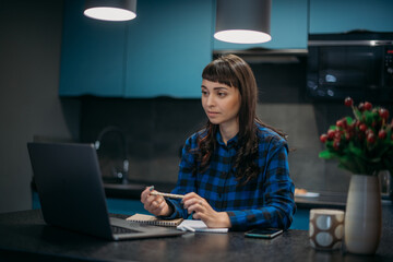 Young woman teacher conducts an online lesson. Distance learning and exam preparation.