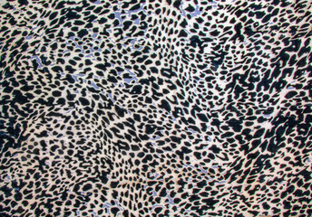 Background with leopard texture, close up. Leopard dyed fabric.