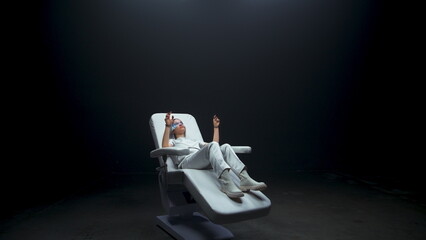 Future reality person using invisible touchscreen. Sensor gloves girl metaverse