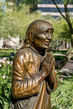 Phoenix, AZ - Nov. 12, 2022: This bronze statue of Saint Teresa of Calcutta by Michael Myers is at Virginia Piper Plaza outside St. Mary's Roman Catholic Basilica.