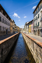 Fototapeta na wymiar Lucca, Italy. Picturesque river channel in the old town