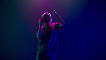 Man gaming moving in invisible space using VR. Future and entertainment concept