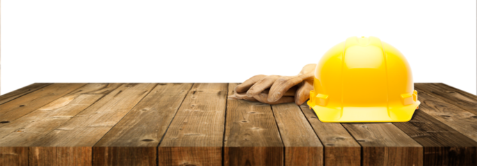 Transparent PNG Yellow Hard Hat and Gloves on Wood Table Top Surface.