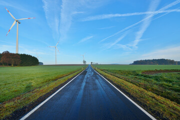 Country Road in Morning with Wind Turbines, Freiensteinau, Vogelsbergkreis, Hesse, Germany
