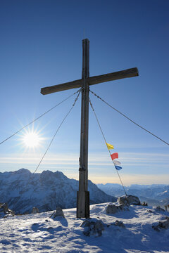 Cross and Buddhist Prayer Flags at Summit, Steinplatte, Waidring, Tyrol, Austria