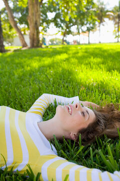Woman Lying on Grass, Miami Beach, Florida, USA