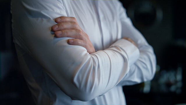 Unknown Businessman Standing Dark Restaurant Interior. Closeup Folded Man Hands