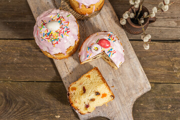 Traditional Easter cake. Festive sweet food with icing and decor. Eggs, nest, willow