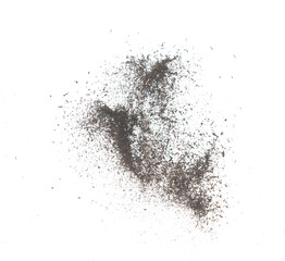 Fototapeta premium Black dried leave Tea explode. Small Fine size tea leaf flying explosion, Abstract cloud fly. Brown colored Teas splash throwing in Air. White background Isolated high speed shutter, throwing freeze