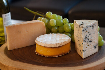 Cheese plate and wine including chardonnay, gourmet crackers