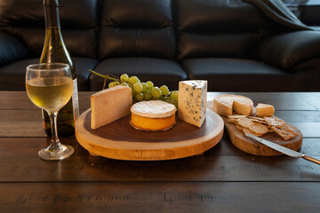 Cheese plate and wine including chardonnay, gourmet crackers