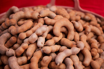 Ripe sweet tamarind fruit in the basket