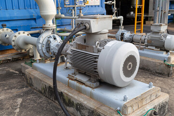 Fototapeta na wymiar an electric motor-driven centrifugal pump that is put in an oil refinery or chemical factory. Industrial and technological work concept to transmit liquids to various production units of enterprises.