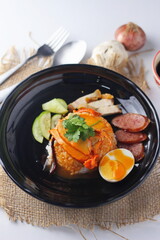 Barbecued red pork in sauce with rice served in the restaurant. There are many sold in Thailand.Barbecued red pork in sauce with rice is a popular food in Thailand.