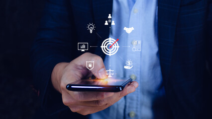 Hand pointing icon virtual screen on smart phone of Digital target marketing advertising and sales increase business technology concept, online marketing, E-business, Ecommerce, Business online.