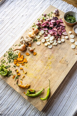 Colorful vegetables ready to use on a cutting board - healthy vegan and vegetarian lifestyle flat lay