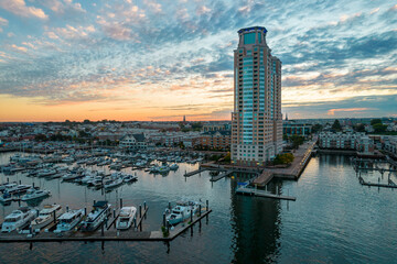 Aerial Drone View of Baltimore City Apartment Complex along the Water at Sunset with Boats Docked...