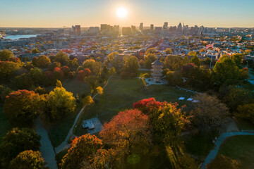 Aerial Drone View of Patterson Park in Baltimore City in Fall at Sunset with the City Skyline in the Distance