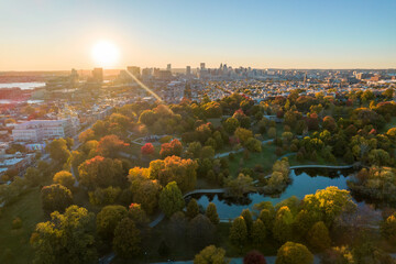 Aerial Drone View of Patterson Park in Baltimore City in Fall at Sunset with the City Skyline in the Distance