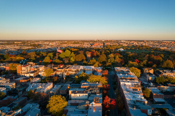 Aerial Drone View of Patterson Park in Baltimore City in Fall at Sunset with the City Skyline in...