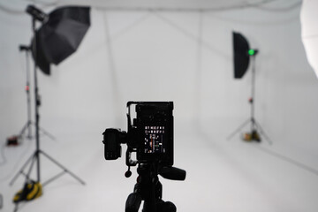 An empty photo Studio with white cyclorama. Monoblocks with flashes using softboxes of different shapes. photographic photography studio space with white cyclorama