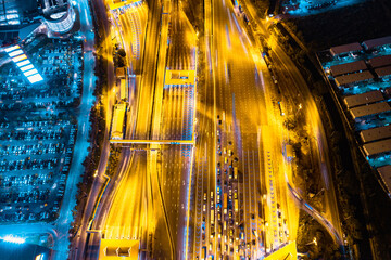 Aerial top view of Cars Passing Through The Automatic Point Of Payment On motorway Toll Road at night. Point Of Toll Highway, Toll Station. Highway Toll Plaza. night scene.