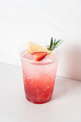 strawberry with soda in glass