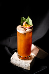 cocktail - infused tequila with basil, passion fruit and cinnamon, lime and mango