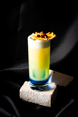 cocktail - blue curacao, infused rum with passion fruit, apple syrup, pineapple juice and lime juice