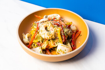 fettuccini spaghetti pesto seafood on plate