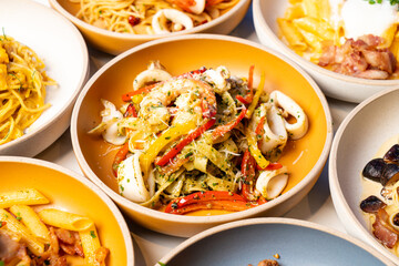 fettuccini spaghetti pesto seafood on plate