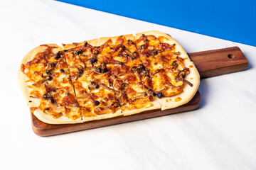 tart flambe mushroom pizza on wood board