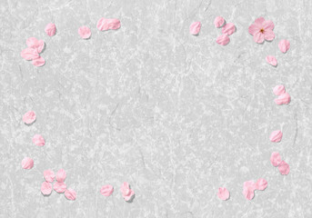 砂子雲龍の模様がきれいな銀色和紙と、舞い散る桜の花